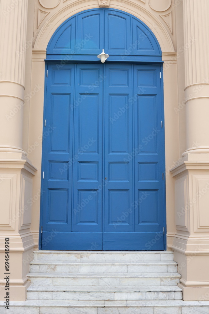 Wood painted blue door closed and stair in retro style. Wood painted blue door closed and stair in retro style.