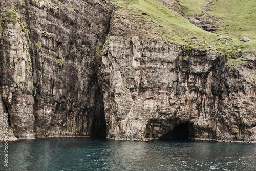 Faroe islands cliffs and caves in Vestmanna area. Streimoy, Denmark