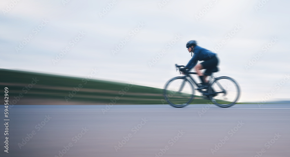 Motion blur, race and cycling with woman on road for training, competition and championship. Workout, sports and triathlon with female cyclist riding on bike for freedom, exercise and fast with speed Motion blur, race and cycling with woman on road for training, competition and championship. Workout, sports and triathlon with female cyclist riding on bike for freedom, exercise and fast with speed