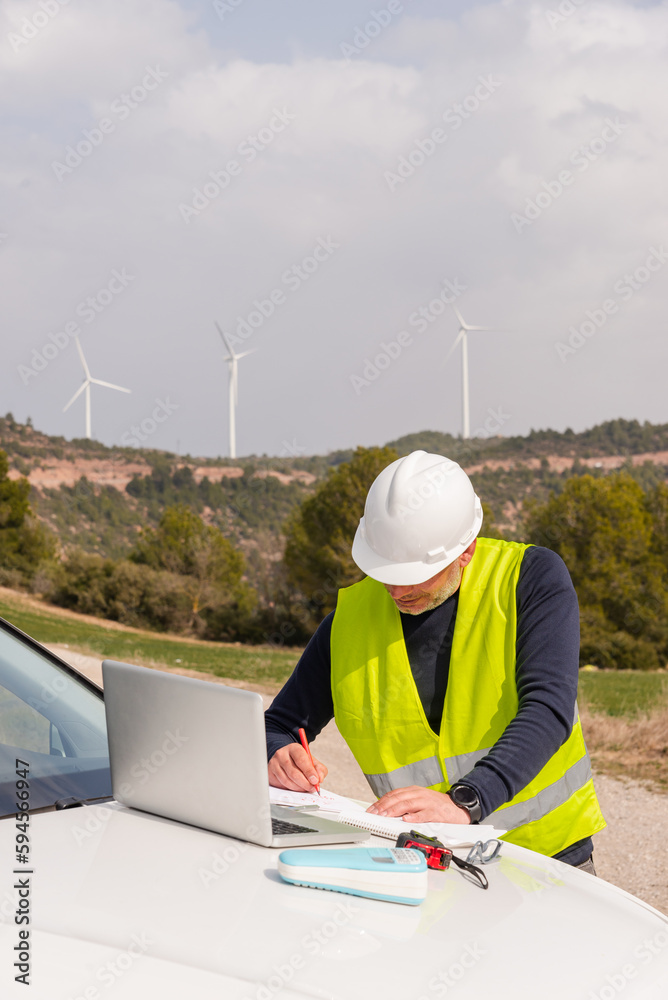 wind turbine engineer consulting blueprint of sustainable, clean and green energy wind farm
wind turbine engineer consulting blueprint of sustainable, clean and green energy wind farm