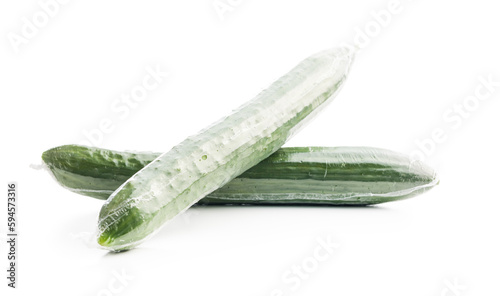 Fresh green cucumbers wrapped in plastic wrap isolated on white background.