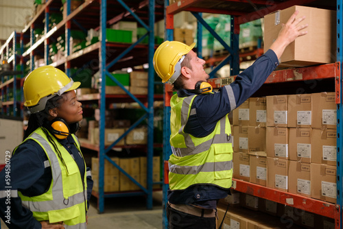 Group of Industrial workers working at warehouse factory.