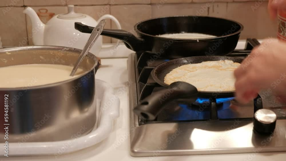 woman preparing breakfast dinner lunch pancakes with meat visible food human hands plate frying pan