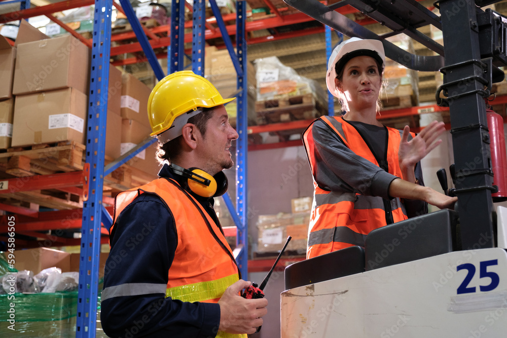 Group of Industrial workers working at a warehouse factory. Group of Industrial workers working at a warehouse factory.