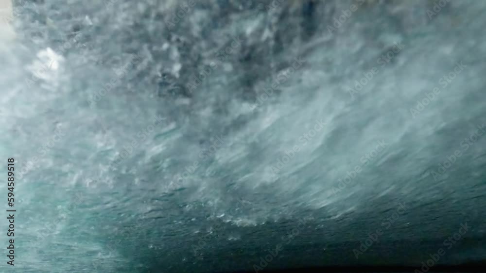 Washing car with rotating brushes on automatic wash, inside view Washing car with rotating brushes on automatic wash, inside view