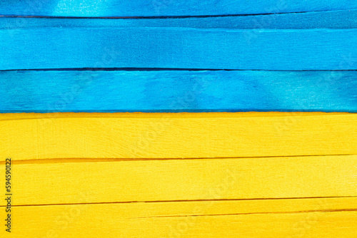 Blue and yellow separated wooden background. Abstract flag of Ukraine with blue and yellow colors on the wooden texture.