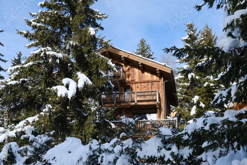 Wooden chalet in the alps on a cold winter