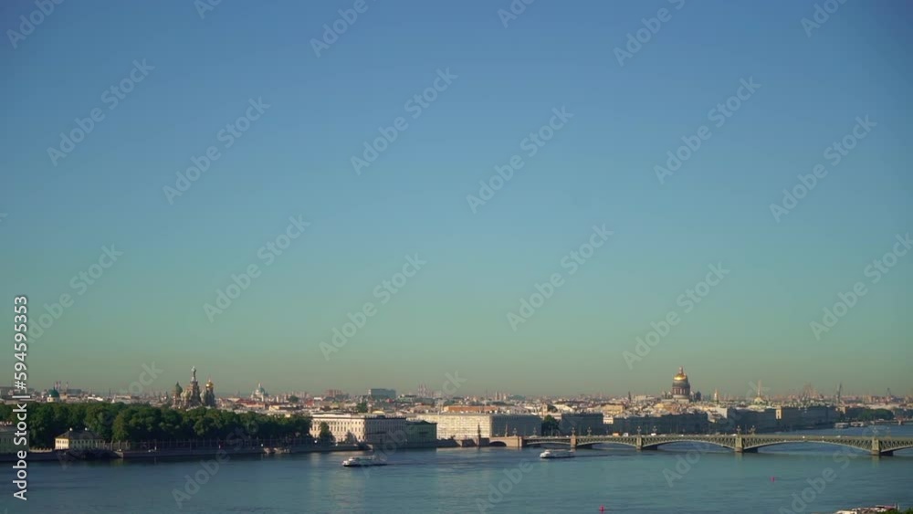 View of the city from above. Saint-Petersburg, Russia. Neva river, city embankment, road with car traffic, bridges. Cruiser Aurora. View of the city from above. Saint-Petersburg, Russia. Neva river, city embankment, road with car traffic, bridges. Cruiser Aurora.