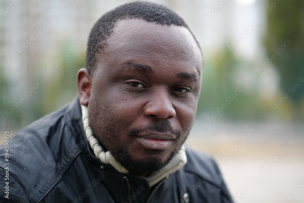 Fototapeta premium African american man from Nigeria looks at camera