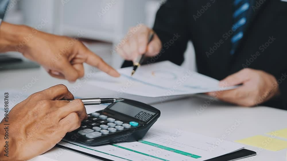 Financial analysts analyze business financial reports on a digital tablet planning investment project during a discussion at a meeting of corporate showing the results of their successful teamwork.