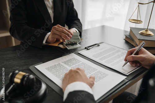 Government tax officials, legal advisers taking bribes of citizens wrapped in brown envelopes. Opening the annual tax evasion, the concept of bribing tax evader officials.