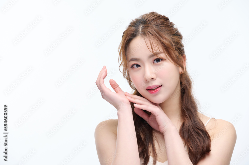 Beautiful Young Asian woman with clean fresh skin touching two hands on face in beauty pose. Pretty girl smiling in white background. Facial treatment, cosmetology, cosmetic surgery, make up concept. Beautiful Young Asian woman with clean fresh skin touching two hands on face in beauty pose. Pretty girl smiling in white background. Facial treatment, cosmetology, cosmetic surgery, make up concept.