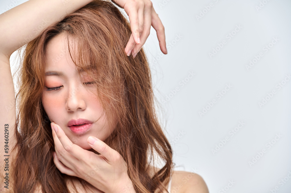 Beautiful Young Asian woman with clean fresh skin touching two hands on face in beauty pose. Pretty girl smiling in white background. Facial treatment, cosmetology, cosmetic surgery, make up concept. Beautiful Young Asian woman with clean fresh skin touching two hands on face in beauty pose. Pretty girl smiling in white background. Facial treatment, cosmetology, cosmetic surgery, make up concept.