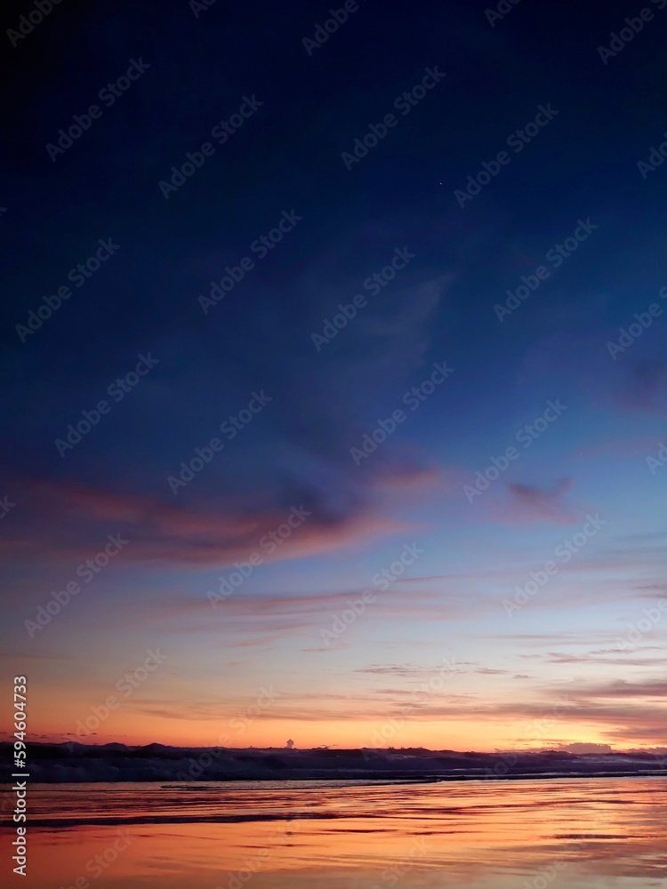 the daily disappearance of the Sun below the horizon due to Earth's rotation