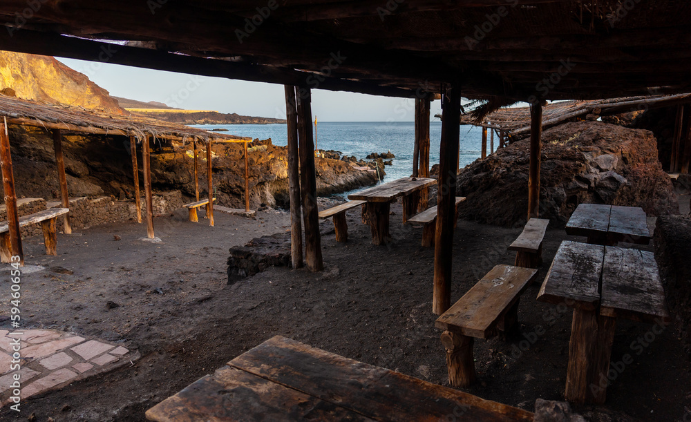 Recreational area for barbecues at sunset on the beach of Tacoron in El Hierro, Canary Islands