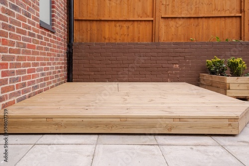 Newly built wooden deck in back garden. photo