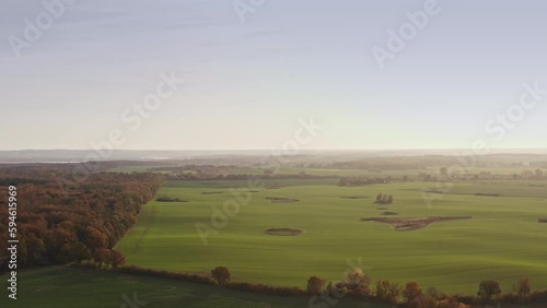 A descending drone flight over a landscape in Brandenburg, Germany, during autumn.
