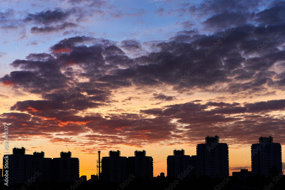 The silhouette of the city against the beautiful sky during sunset. Tall buildings in Minsk