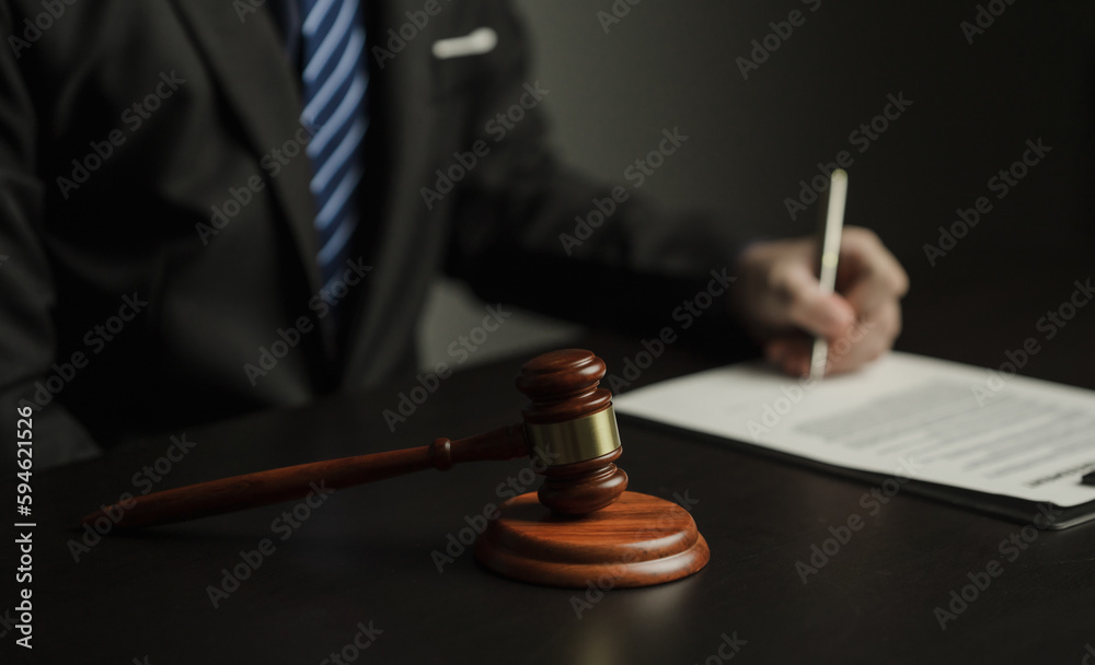 Male lawyer working in a law firm Judge wrestling with scales of justice. Law, lawyer, advice and justice. Male lawyer working in a law firm Judge wrestling with scales of justice. Law, lawyer, advice and justice.