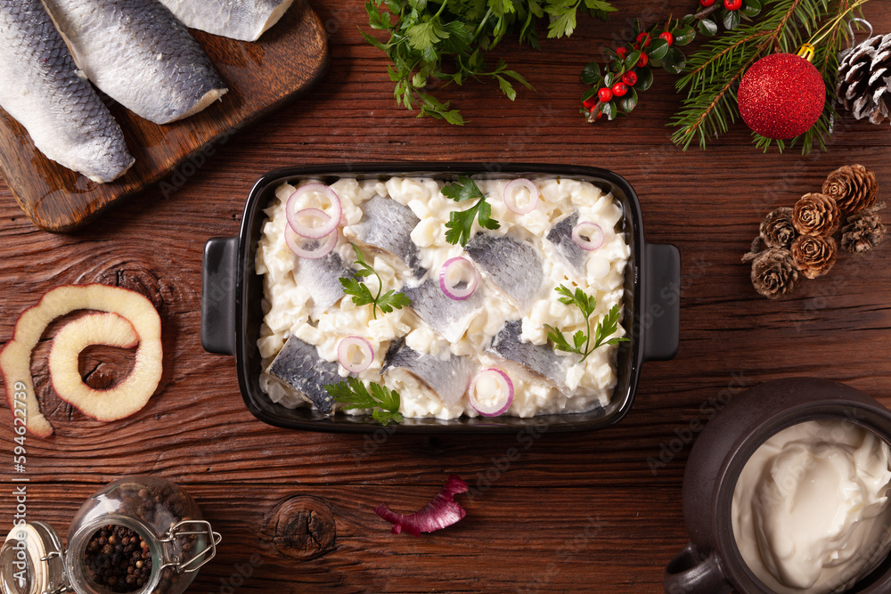 Herring fillet salad in cream with apple.