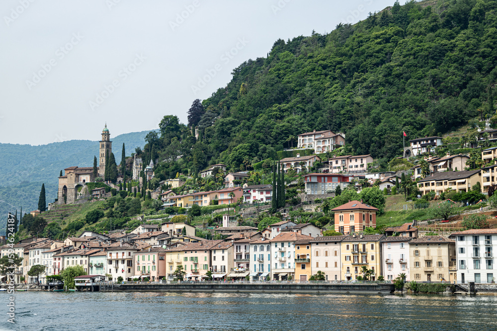 Morcote, Ticino, Switzerland - May 21, 2022 Morcote, Santa Maria del Sasso church and lake Lugano  from the ferry landscape
