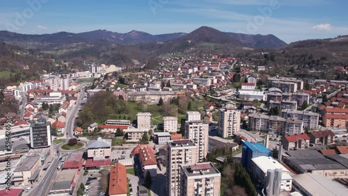 Aerial View of Trbovlje, Slovenia. Valley Town and Residential Buildings on Sunny Day photo