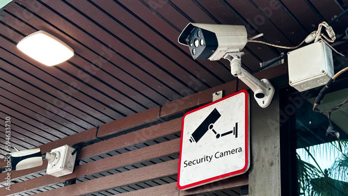 View of security camera and security sign which surrounded by dirty dust environment