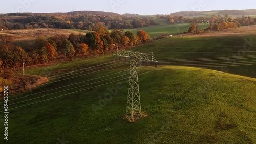 A drone soars above an electricity pylon. Location: Germany 