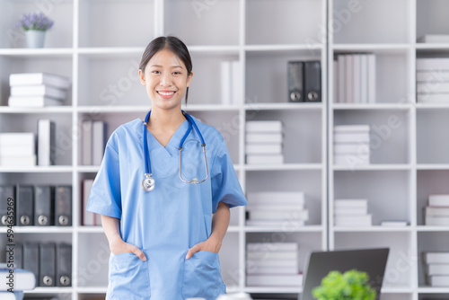 Smiling of doctor recommends taking medicine, supplement, vitamins, Practitioner with bottle of pills. white plastic pill bottle on doctor wooden table. 