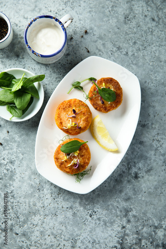 Traditional homemade fish cakes with lemon