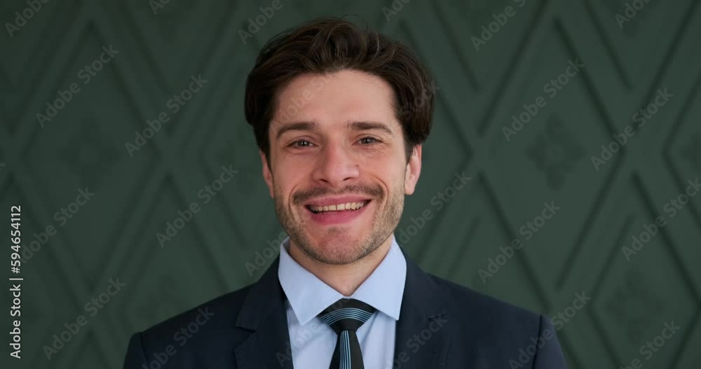 Portrait of handsome businessman getting ready by adjusting necktie in the office