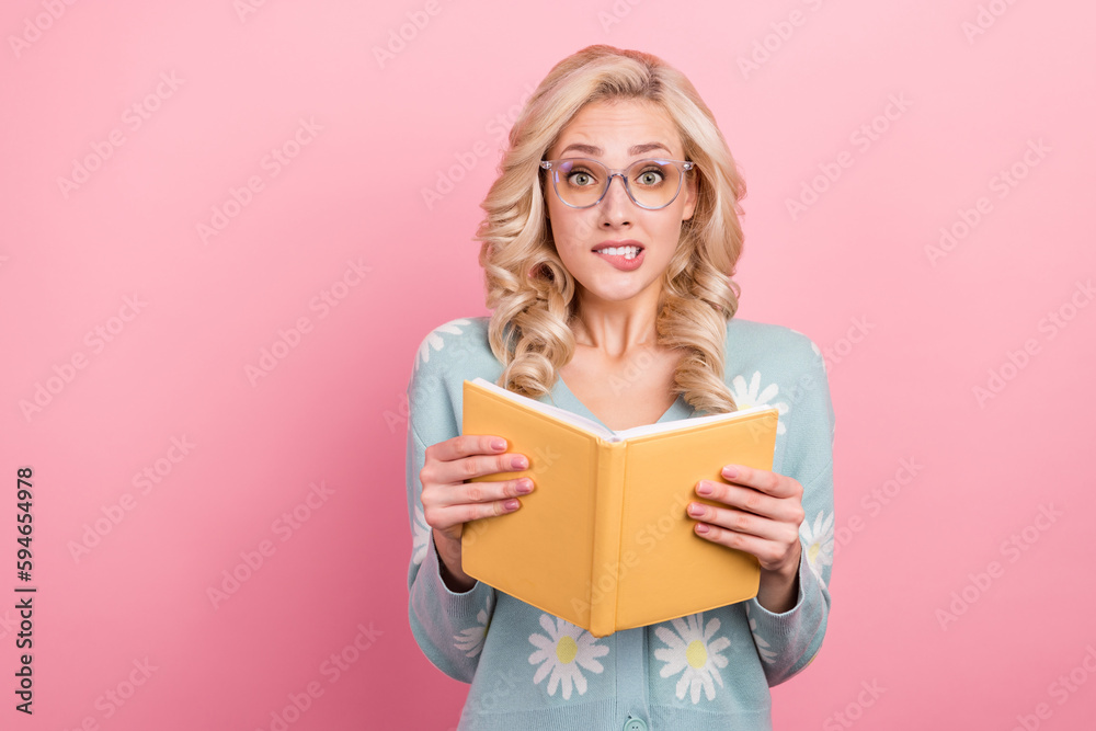 Photo of young teacher blonde wavy hair girl hold her diary reading bad stories classmates bite lips isolated on pink color background Photo of young teacher blonde wavy hair girl hold her diary reading bad stories classmates bite lips isolated on pink color background