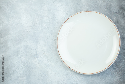 Empty plate on gray background with distressed coarse-grained gradient surface