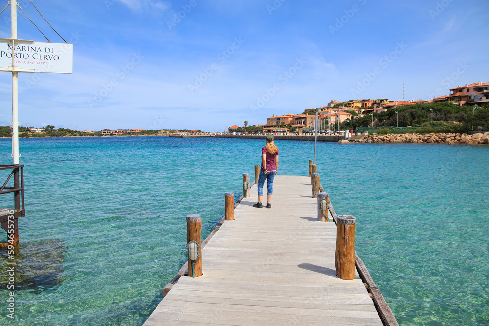 Obraz premium A women is watching the sea in Porto Cervo, Sardinia