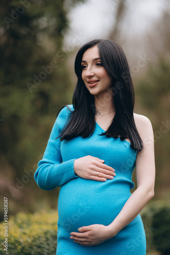 A modern pregnant woman, smiling, happy to be pregnant. © Vitaliy