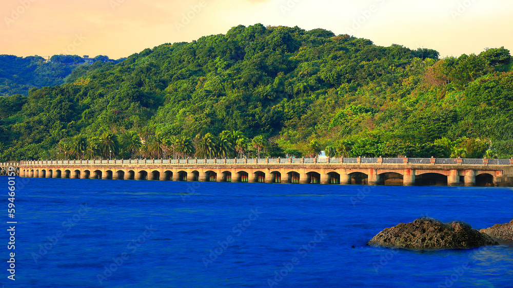 Charming multiple span bridge coast scenery,blue sea,scenic view. Sizihwan, Gushan,Kaohsiung,Taiwan.for branding,calender,postcard,screensave,wallpaper,poster,banner,cover,website.High quality photo