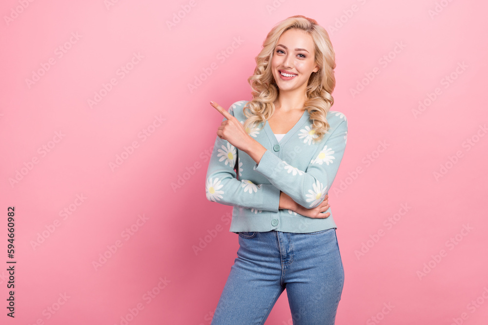 Photo of young funny curly hair woman recruiter directing finger empty space ad wear daisy flower shirt isolated on pink color background Photo of young funny curly hair woman recruiter directing finger empty space ad wear daisy flower shirt isolated on pink color background