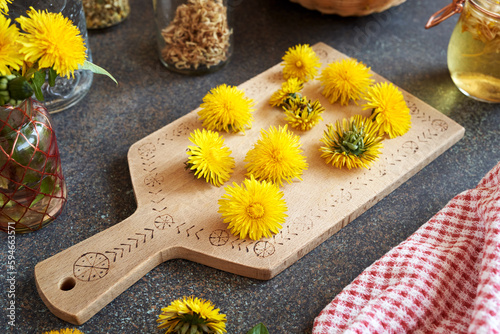 Fresh dandelion flowers on a table indoors
