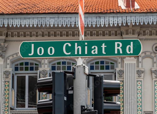 Photography Green road sign in downtown Singapore