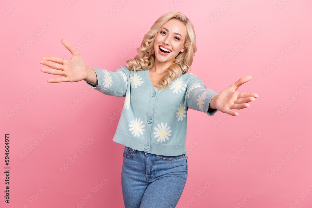Photo of cheerful excited girl raise opened arms invite welcome you isolated on pink color background Photo of cheerful excited girl raise opened arms invite welcome you isolated on pink color background