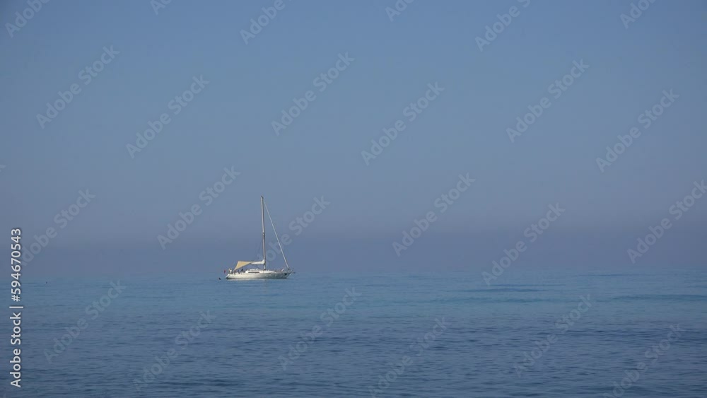 Yacht floating offshore in the blue sea Yacht floating offshore in the blue sea