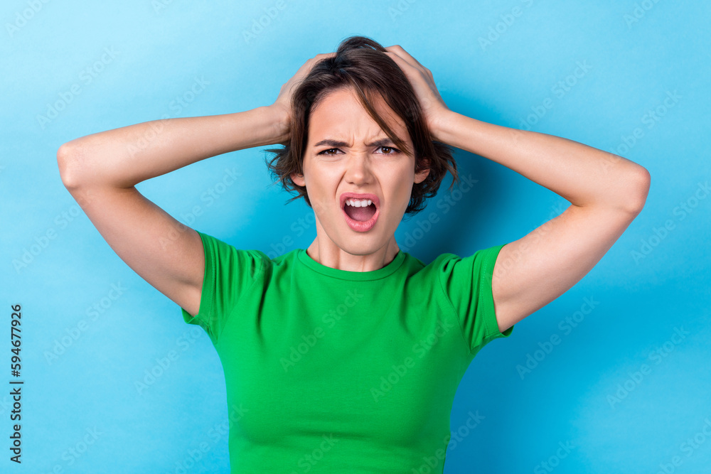 Photo of unsatisfied young woman hands head problems forgot correct answers failed last driving test examination isolated on cyan color background Photo of unsatisfied young woman hands head problems forgot correct answers failed last driving test examination isolated on cyan color background