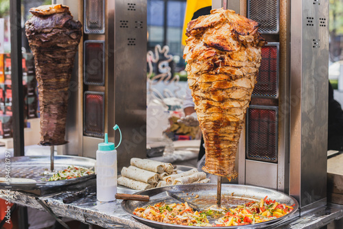 Traditional turkish food chicken doner and beef doner kebab on street vedor.