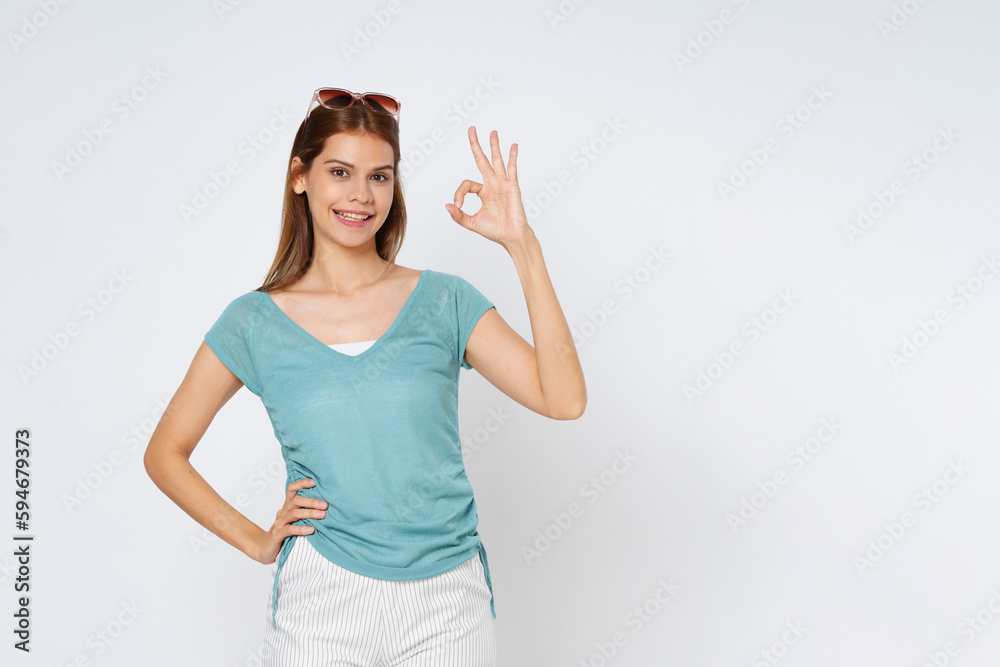 Portrait of young woman showing ok sign isolated on white background. Portrait of young woman showing ok sign isolated on white background.
