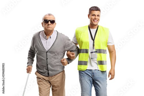 Community worker helping a blind man