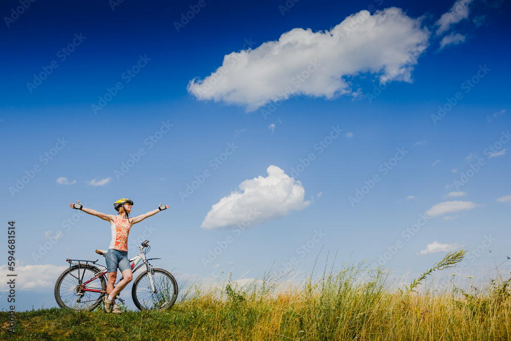 Mountain biking - woman with bike enjoy summer vacation Mountain biking - woman with bike enjoy summer vacation
