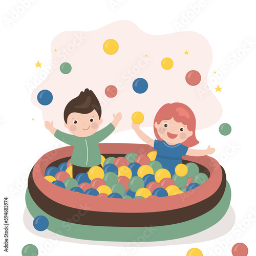 Funny little kids sits and plays in pool with plastic balls. Children party in entertaining playroom. Colored play balls for small children. Childhood, education