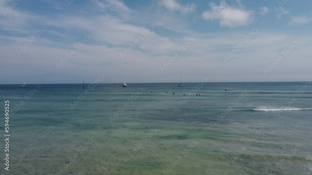 Aerial of people surfing on the calm waves of the ocean in Punta Mita, Puerto Vallarta Mexico Aerial of people surfing on the calm waves of the ocean in Punta Mita, Puerto Vallarta Mexico