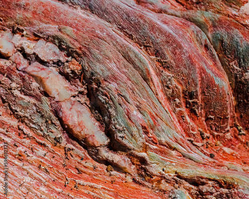 Red swirls. A close-up of a sandstone cutting on Robinson Pass, Western Cape.