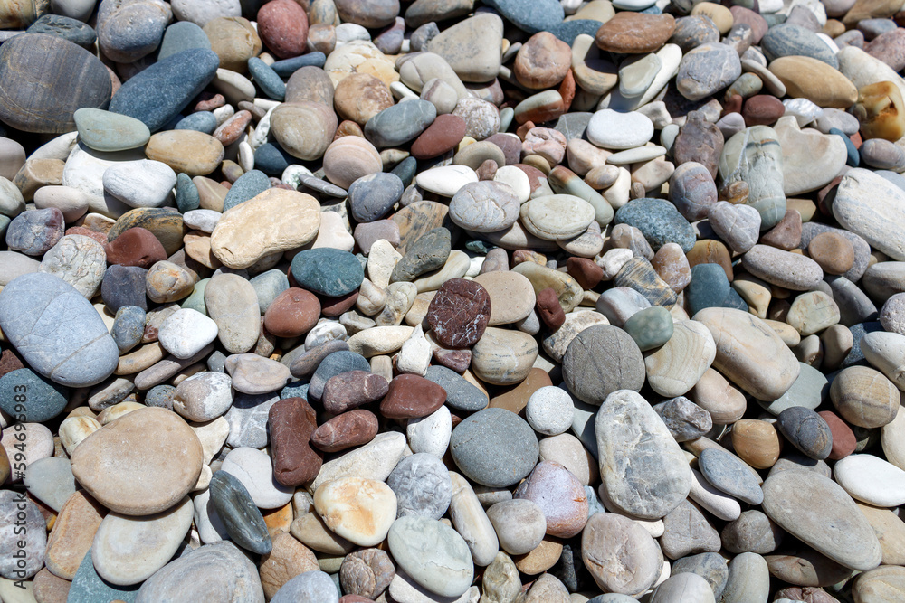 Background of dry multi colored stones and pebbles on sea beach Background of dry multi colored stones and pebbles on sea beach